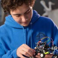 Student adjusts robot